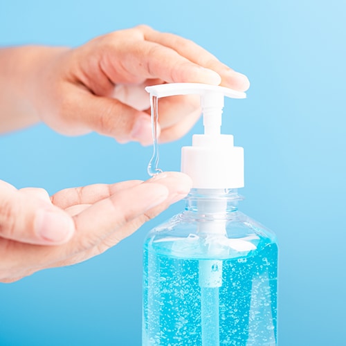 Person using hand sanitizer
