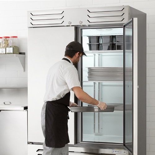 Man opening energy star certified fridge
