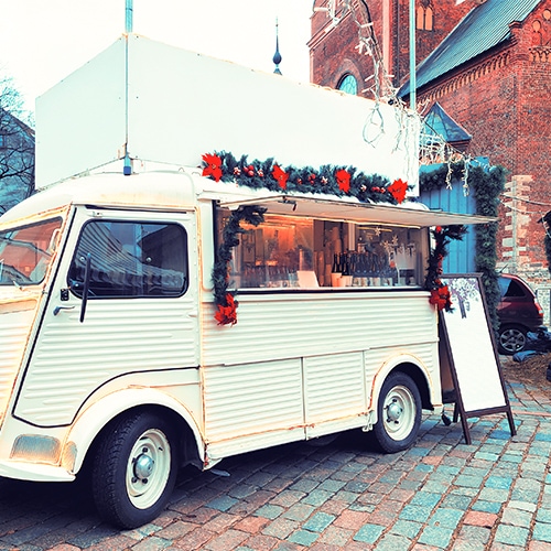 Food Trucks Parked on Brick Road