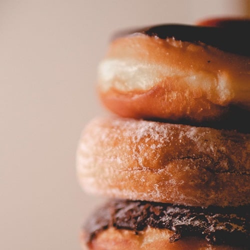 close up shot of donut with chocolate icing