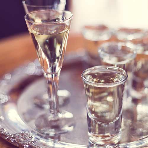 closeup of glasses filled with aquavit