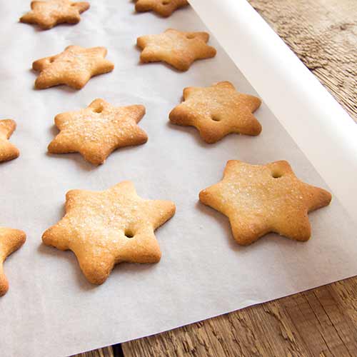 star-shaped sugar cookies on parchment paper