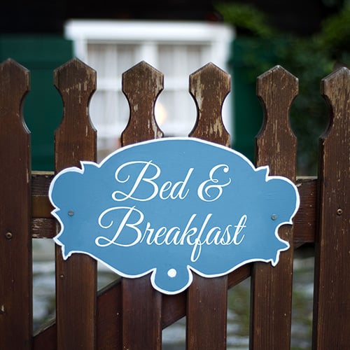 Bed and Breakfast Sign on Fence
