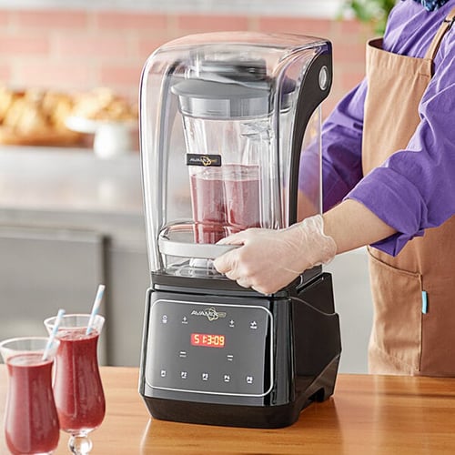 barista removes enclosure from avamix blender