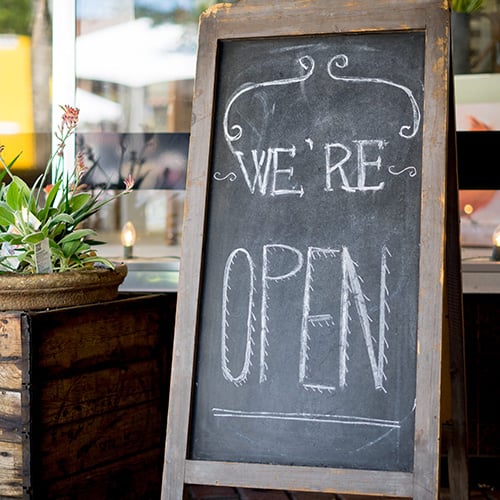 home made farmhouse style we are open sign outside of small business