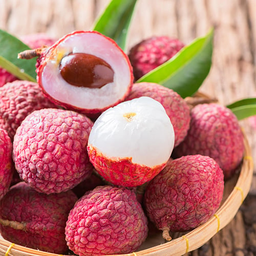 fresh organic lychee fruit in bamboo basket