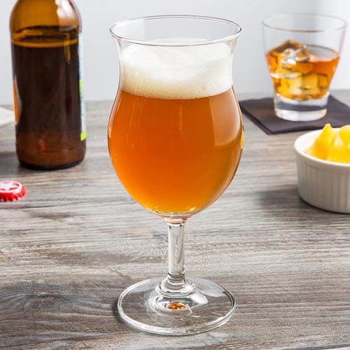 saison with a frothy head in a beer glass
