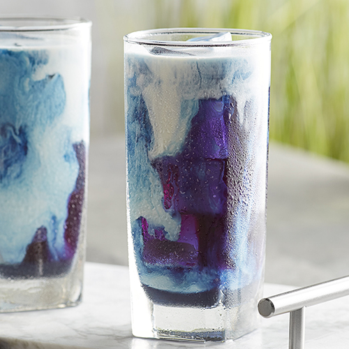 blue and white marbled drink in tall glass