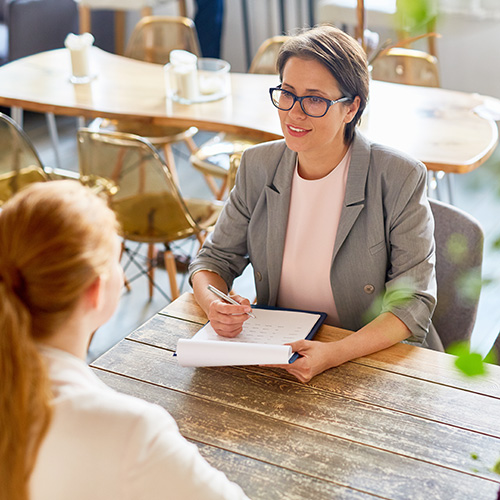 cafe owner interviewing young employee