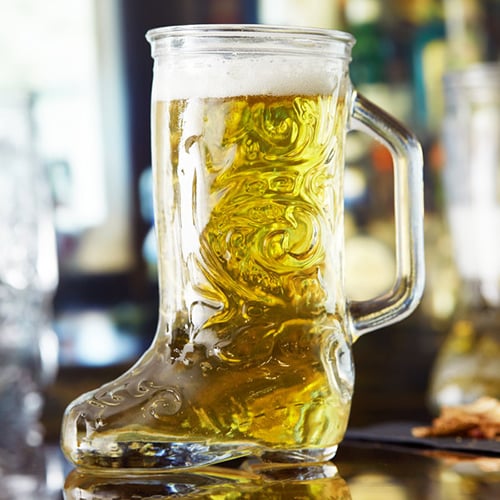 engraved das boot glass with handle filled with light beer