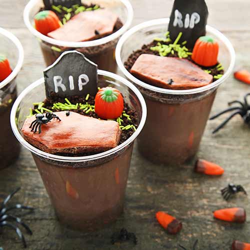 graveyard dessert cups with gingerbread cookie tombstones