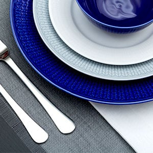 Charger plate under dinner plate