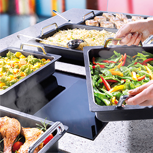 placing a pan of food on a countertop