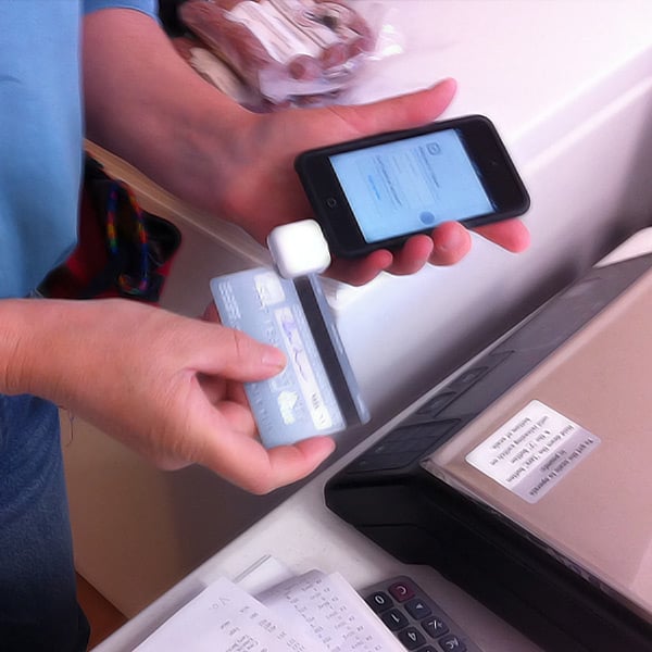 Swiping a card through a mobile POS system
