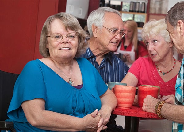 senior woman sitting at a restaurant