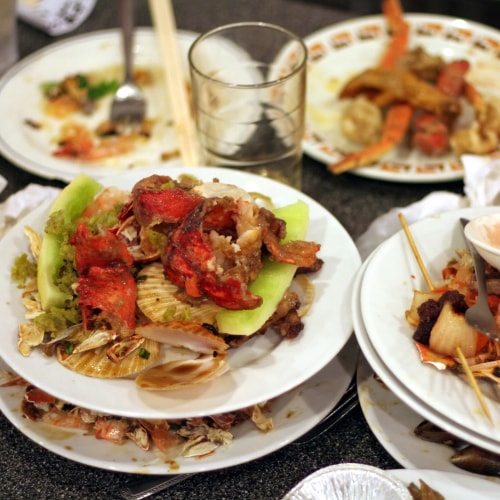 Plates stacked with food scraps