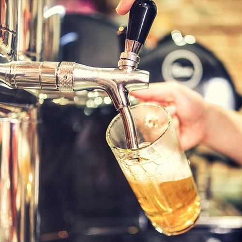 pouring beer at a tap