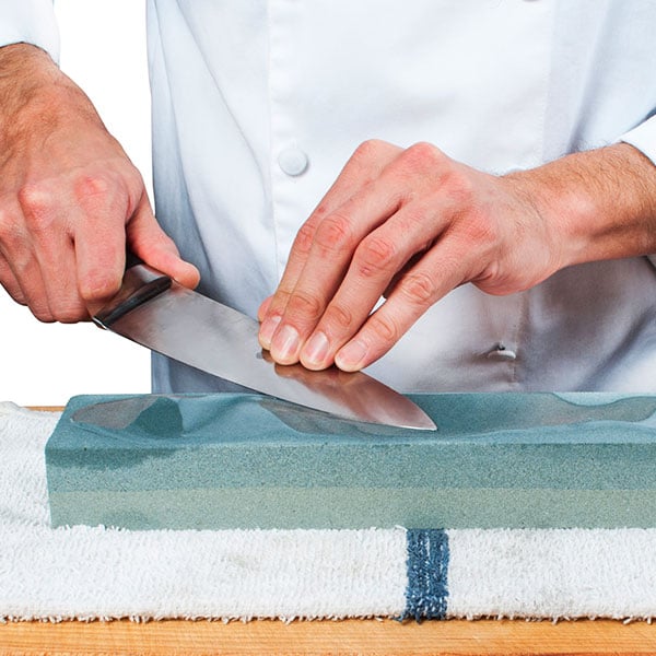 Sharpening a knife with a sharpening stone