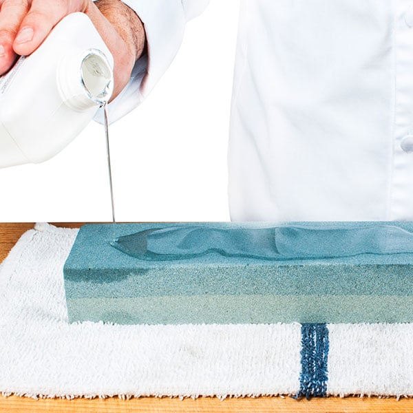 Adding oil to a knife sharpening stone