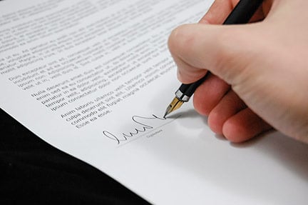 person signing a contract for a business license