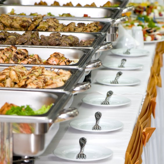 Food sitting at a buffet table