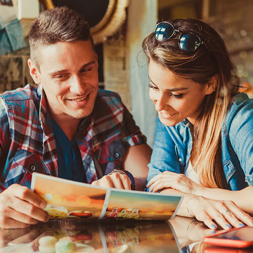 Couple choosing from restaurant menu