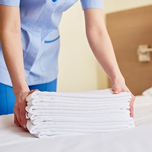 a stack of clean hotel linens